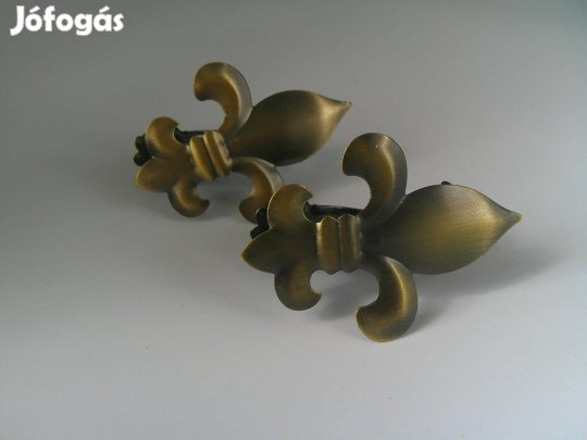Fém cserkészliliom alakú függönyelkötö / függönyösszefogó csipesz elad