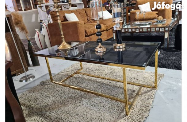 Glamour stílusú dohányzóasztal arany színű átlátszó üveglappal