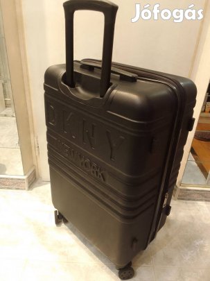 Gurulós utazó bőrönd DKNY eladó. 57×37×24cm. Használt