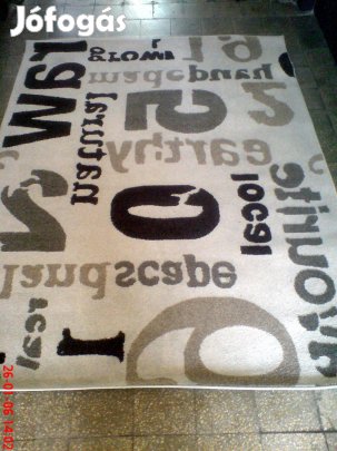 Jó állapotú modern, 160x220 cm méretű, krém alapszínű szőnyeg eladó