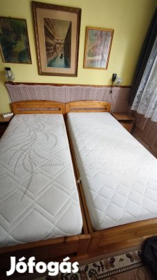 Kettő darab fenyőfa ágykeret, ágyneműtartós matracokkal eladó!