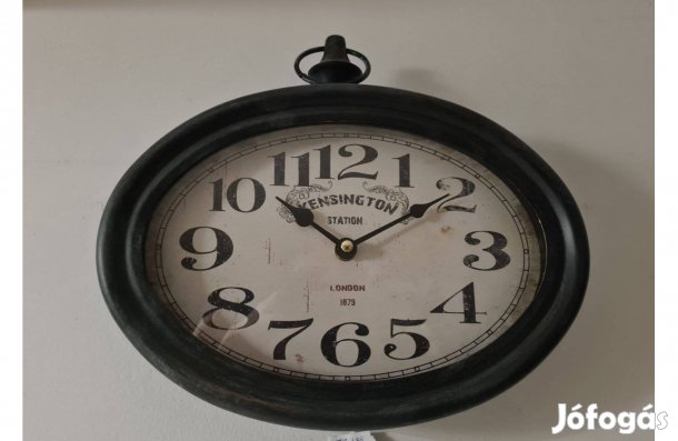 Ovális fém falióra Kensington felírattal 30 cm