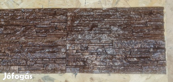 Sötét barna színű pattintott kő hatású kül és beltéri falburkolat 
