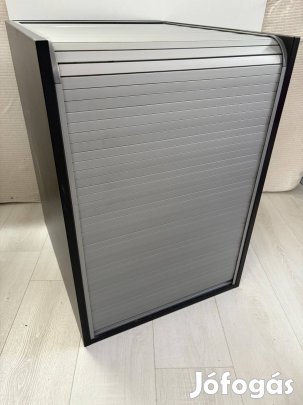 Sötétszürke redőnyös kisszekrény