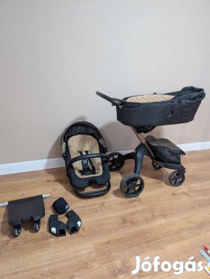 Stokke Xplory X, arany-fekete babakocsi kiegészítőkkel