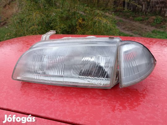 Suzuki Swift bal oldali fényszóró indexel együtt 