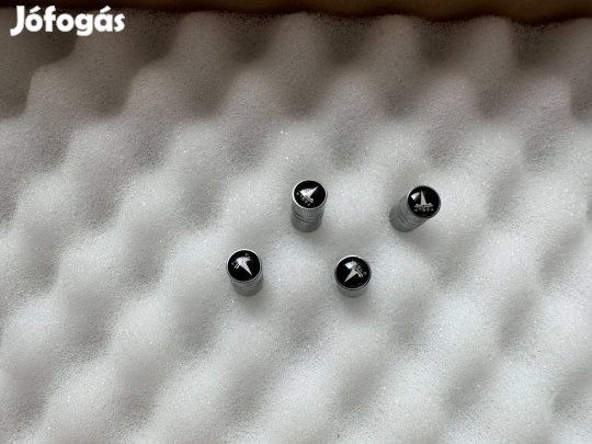 Tesla szelepsapka ezüst színű Tesla felni szelep sapka 4db új 1000Ft