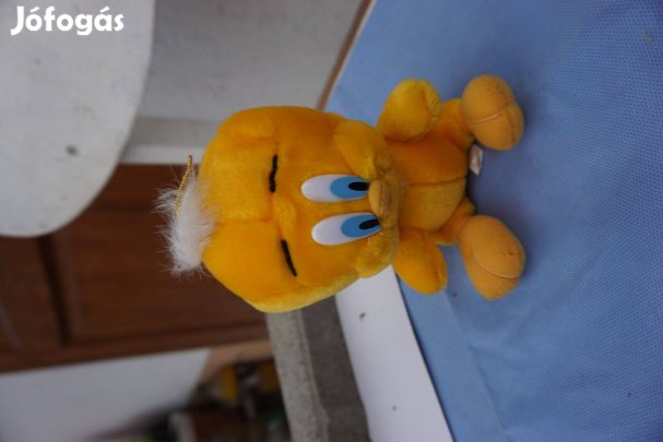 Ülő sárga nagy fejű és nagy fekér szemű plüss űrbébi eladó