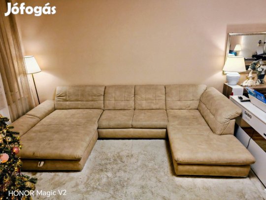 XXL méretű ,beige szinű kanapé ágynemű tartóval eladó