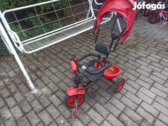 fémvázas, pedálos tricikli tolókarral és tetővel